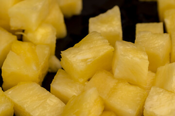 sliced ripe yellow pineapple, a large number of pieces