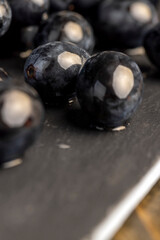 sweet ripe black grapes covered with drops of water