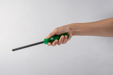 Hand and screwdriver tools on white background