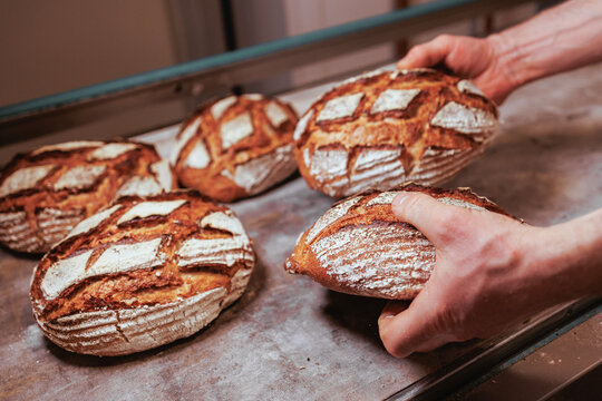 Organic Bakery - details of baker baking bread