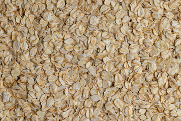 Poured a large amount of oat flakes close-up