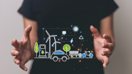 Woman on blurred background holding renewable energy icons with her hands 3D rendering