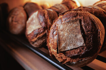 Organic Bakery - details of baker baking bread