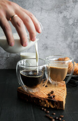 
Coffee with milk. Morning. On a dark background. Breakfast