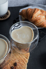 
Coffee with milk. Morning. On a dark background. Breakfast