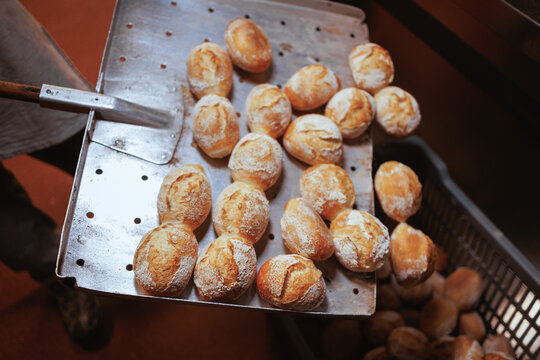 Organic Bakery - details of baker baking bread
