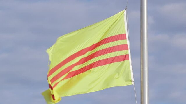 The flag of south Vietnam waving in the wind. Close Up.