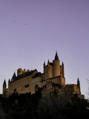 Obraz premium Segovia's castle at sunset