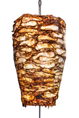 Turkish doner kebab isolated on white background. Rolling meat doner in iron stick.