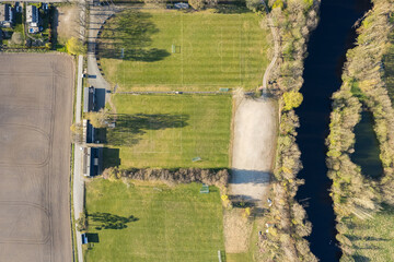 Aerial view of the fields, football pitch. Agriculture, sunny day. Beautiful nature environment, ecology.