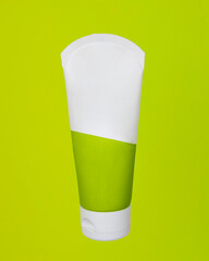 Top view of mockup of white squeeze bottle plastic tube for branding of medicine or cosmetics - cream, gel, skin care, toothpaste. Cosmetic bottle container