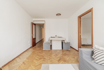 A living room of a house with cardboard furniture covered with fabrics to make them look good