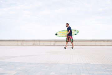 Man with surfing board on longboard © juannovakosky