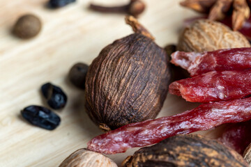 A whole nutmeg fruit on the kitchen table