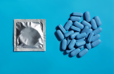 Pils of prescription PrEP Pills for Pre-Exposure Prophylaxis with condoms to help protect people from HIV.