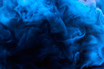 Blue color abstract smoke background. Mix alcohol ink, creative liquid art mock-up with copy space. Acrylic paint waves underwater