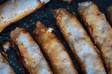 Pork sausages chipolatas pan frying