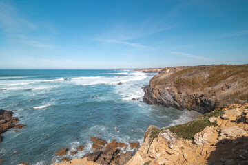 Mountainous and rocky Atlantic Coast during sunny day in the Odemira region, western Portugal. Wandering along the Fisherman Trail, Rota Vicentina