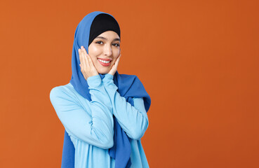 beautiful young smiling muslim woman in traditional religious hijab