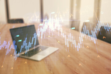 Multi exposure of abstract creative financial chart with world map on laptop background, research and analytics concept