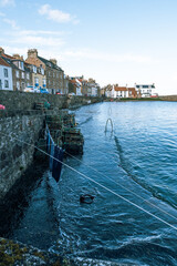 Obraz premium A high Spring tide overwhelms the quayside in the harbour