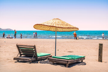 Sunbeds and umbrellas on Iztuzu Beach, Turtle Beach, Dalyan River, Mediterranean Sea, Marmaris, Turkey