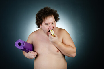 Fototapeta premium Diet, sport and healthy lifestyle. Funny fat and healthy food. 