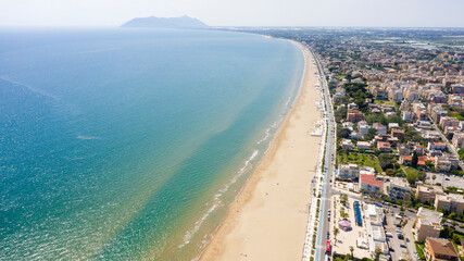 Aerial view of the seafront of Terracina, in the Province of Latina, Italy. In the background is the Circeo promontory.