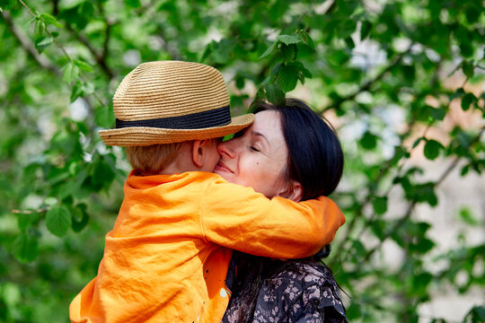 Mother and little son having fun together, hugging. Mothers Day, springtime concept. Family time