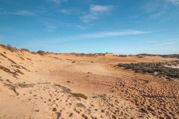 Fototapeta na wymiar Moonscape from another world reminiscent of the desert in the Odemira region, western Portugal. Wandering along the Fisherman Trail, Rota Vicentina