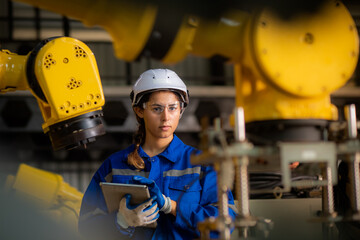Caucasian female engineer, technician wearing safety uniform working use tablet Online information...