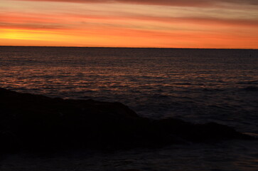 Panoramic view of a beautiful sunrise over the sea. Concept of nature and summer.