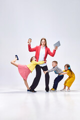 Combination of work and parenting. Portrait business woman, mother and her little kids disturbing,...