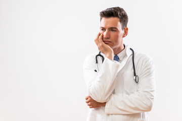 Image of worried doctor thinking.