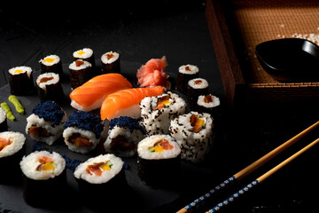 Sushi board, nigiri, sashimi, uramaki, American roll, Japanese food. 
Salmon Nigiri Sushi, Japanese cuisine