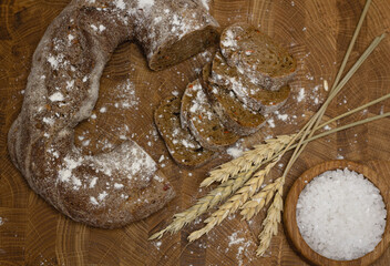 Bread on a wooden board and wheat. flour concept