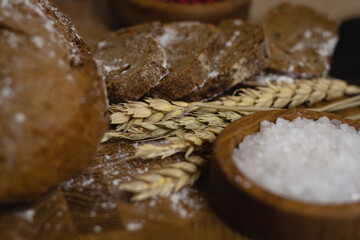 Bread on a wooden board and wheat. flour concept