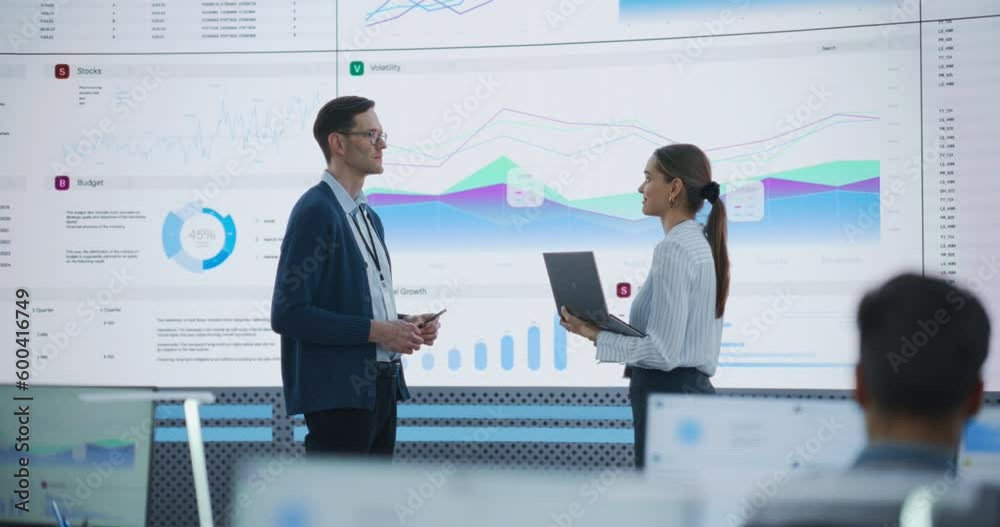 Aufkleber female data scientist and male project manager discussing reports and graphs on big digital screen i