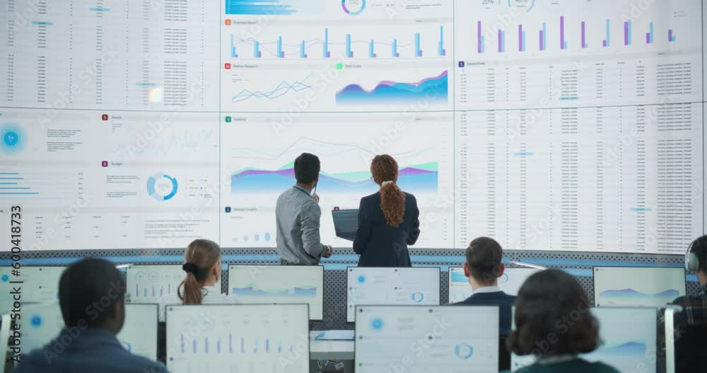 Leinwandbilder wide zoom out back shot of diverse male and female risk managers analyzing data on digital screen in