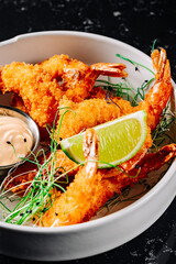 Whole fried big shrimps with seasonings in plate