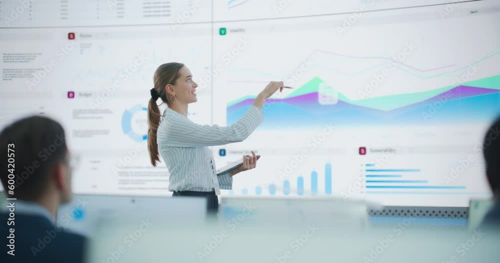 Poster Caucasian Female Data Scientist With Tablet Computer Is Reviewing Reports Of Diverse Employees on Big Digital Screen In Monitoring Room. Team Of Analysts Listening To New Objectives And Tasks.