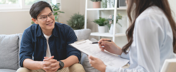 Man talking with mentor psychologist in therapy mental health anxiety session.