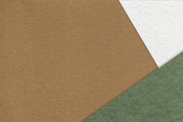 Texture of craft brown color paper background with white and green border. Vintage abstract umber cardboard.