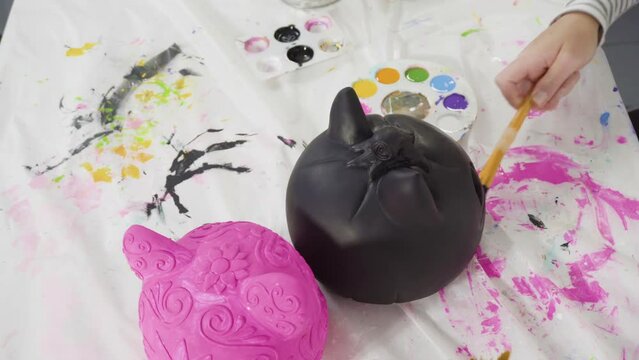Time lapse. Painting craft pumpkin with acrylic paint for Halloween.