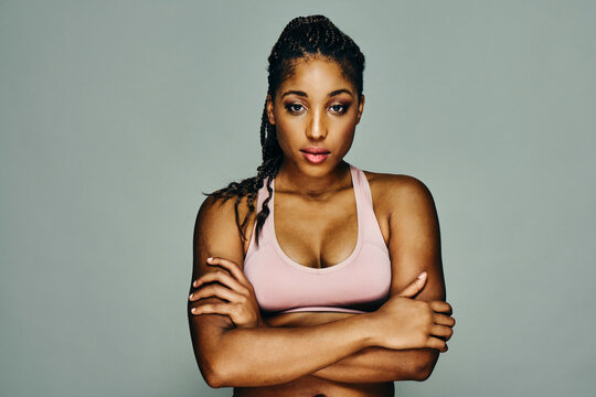 Woman wearing sports bra with arms folded