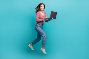 Full body size photo of steps running jump hurry girl much business hold netbook freelance job worldwide isolated on cyan color background