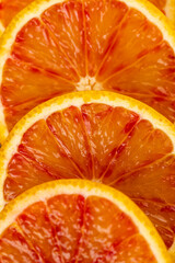 the red-orange flesh of an orange sliced in close-up