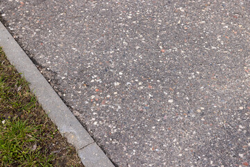 a gravel and stone-strewn walking path in the park