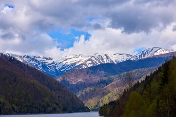 landscape with a lake and mountain in the Carpathian mountains of Romania
