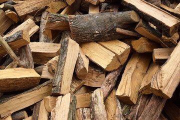 Lots of chopped oak firewood. Natural background.